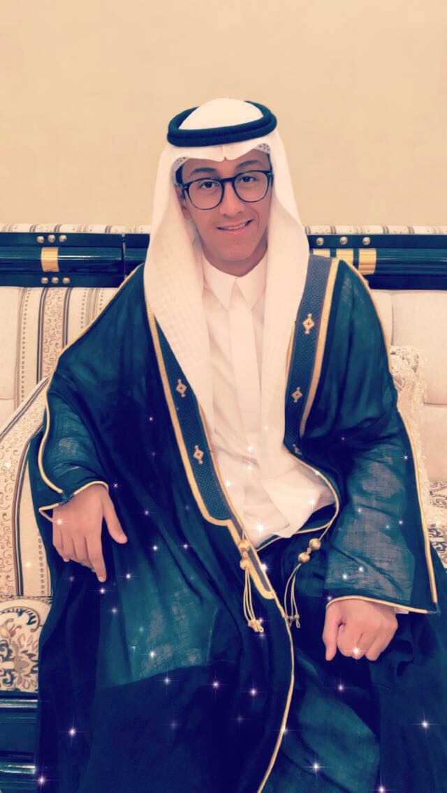 Naif wearing traditional Saudi attire and smiling
